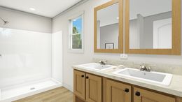 The FREE BIRD Primary Bathroom. This Manufactured Mobile Home features 3 bedrooms and 2 baths.