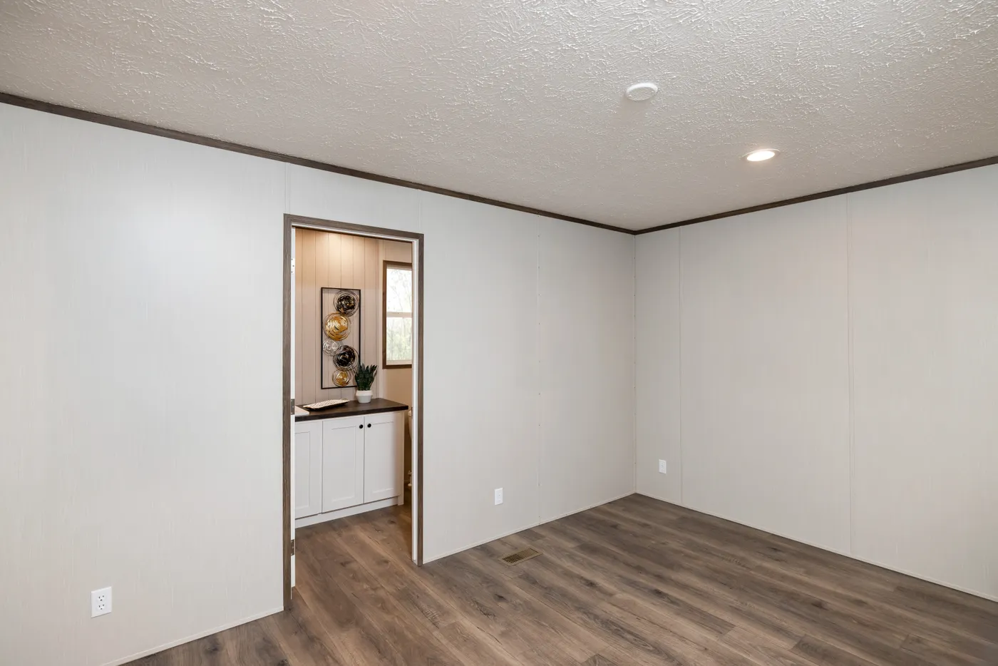 The INTUITION Primary Bedroom. This Manufactured Mobile Home features 3 bedrooms and 2 baths.