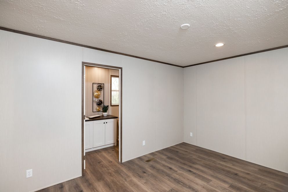 The INTUITION Primary Bedroom. This Manufactured Mobile Home features 3 bedrooms and 2 baths.