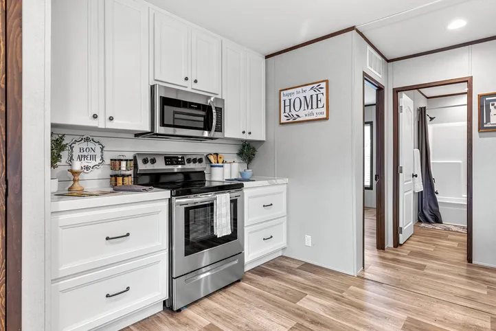 The THE ANNIVERSARY 2.1 Kitchen. This Manufactured Mobile Home features 3 bedrooms and 2 baths.