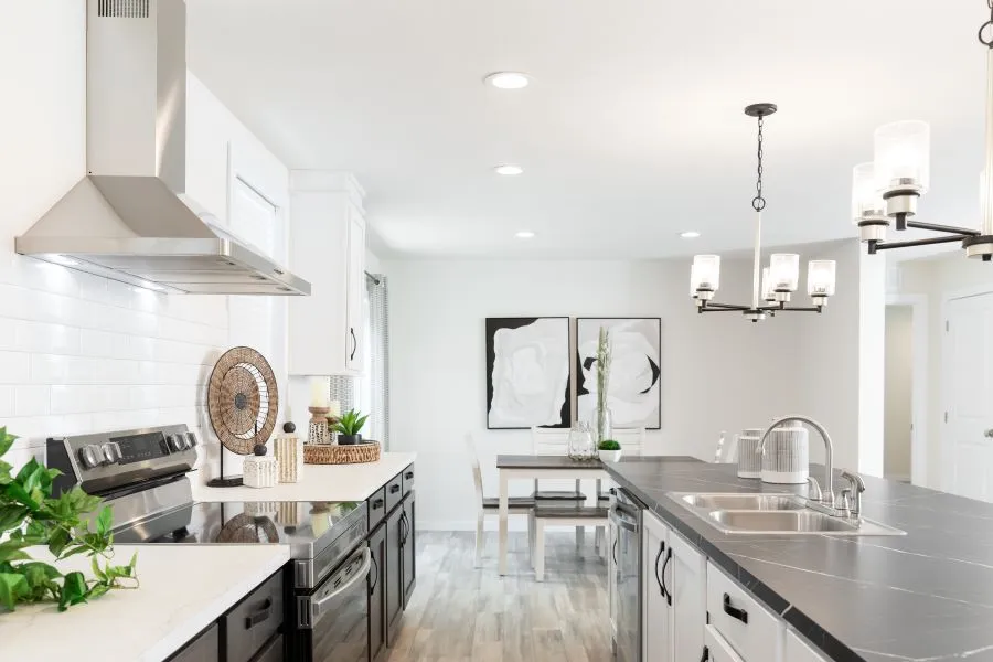 The BUTLER PLACE/6428-MS056 SECT Kitchen. This Manufactured Mobile Home features 3 bedrooms and 3 baths.
