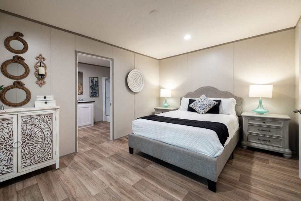 The HORIZON NORTHSTAR 16763A Primary Bedroom. This Manufactured Mobile Home features 3 bedrooms and 2 baths.