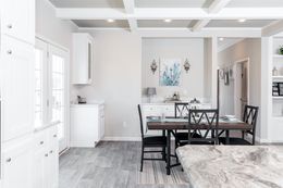 The SUPER 68 ELITE Dining Area. This Manufactured Mobile Home features 3 bedrooms and 2 baths.