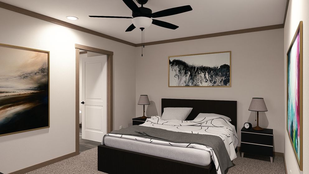 The LEXI Primary Bedroom. This Manufactured Mobile Home features 3 bedrooms and 2 baths.