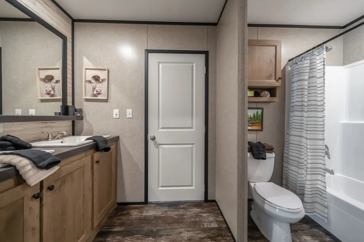 The THE TRIBUTARY Guest Bathroom. This Manufactured Mobile Home features 3 bedrooms and 2 baths.