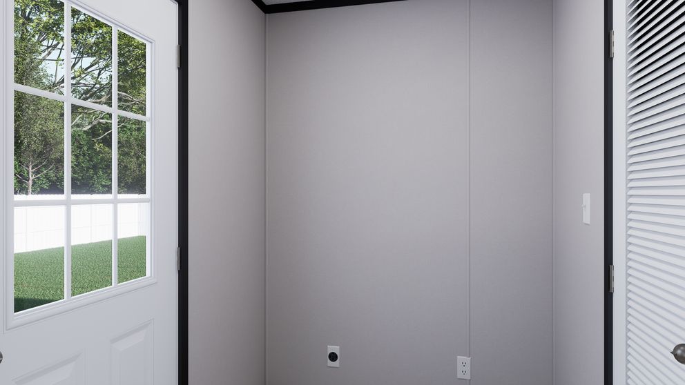 The THE MOUNTAINEER 56 Utility Room. This Manufactured Mobile Home features 3 bedrooms and 2 baths.