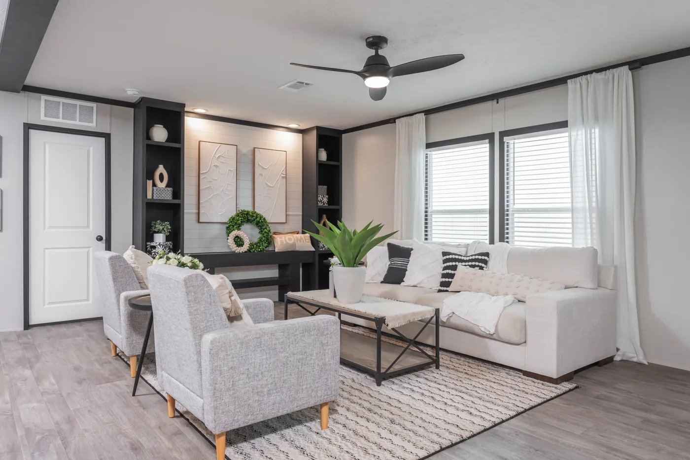 The CRAZY EIGHTS Living Room. This Manufactured Mobile Home features 4 bedrooms and 2 baths.