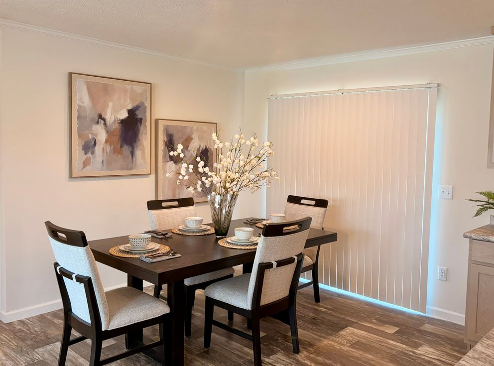 The TOURMALINE 7628-649 Dining Area. This Manufactured Mobile Home features 4 bedrooms and 2 baths.
