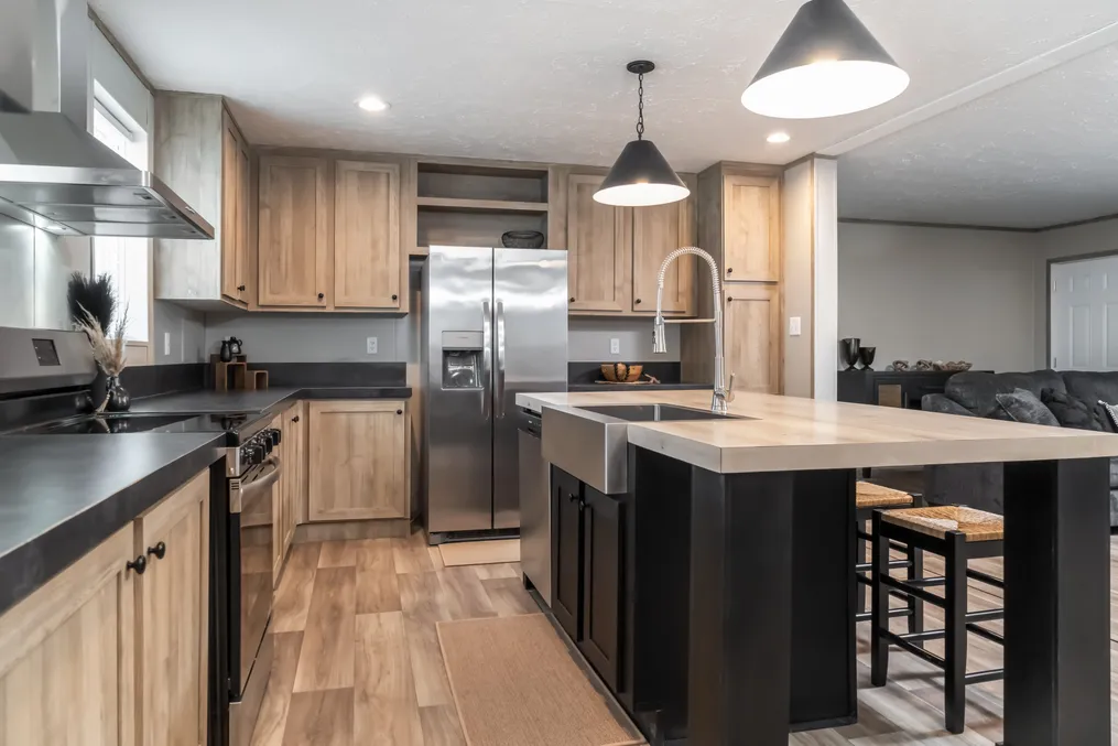 The TRADITION 72 Kitchen. This Manufactured Mobile Home features 4 bedrooms and 2 baths.