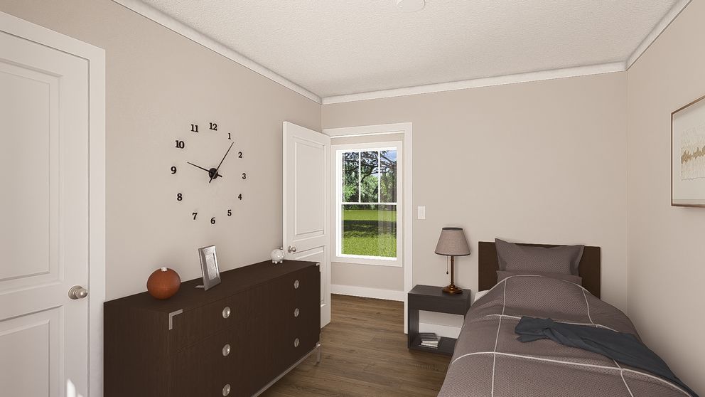 The SWEET CAROLINE Guest Bedroom. This Manufactured Mobile Home features 3 bedrooms and 2 baths.