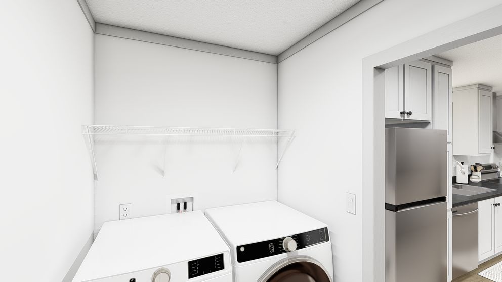 The WONDERFUL WORLD Utility Room. This Manufactured Mobile Home features 3 bedrooms and 2 baths.