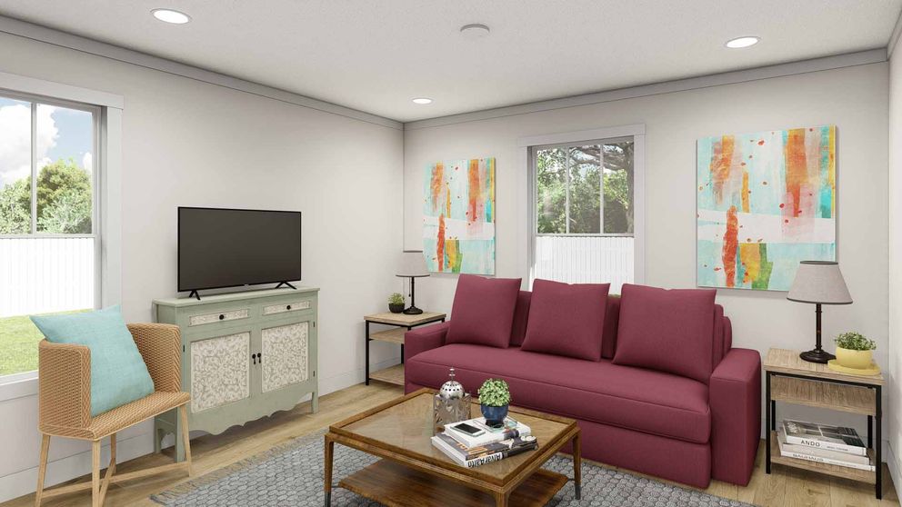 The SATISFACTION Living Room. This Manufactured Mobile Home features 2 bedrooms and 1 bath.