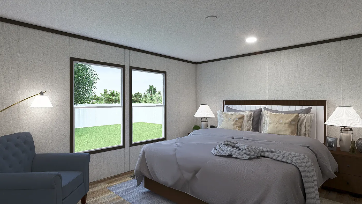 The AMBITION Primary Bedroom. This Manufactured Mobile Home features 4 bedrooms and 2 baths.