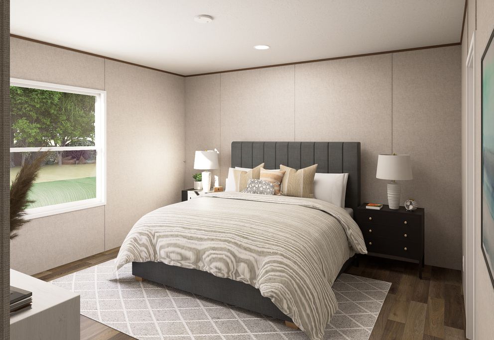 The MAPLE Primary Bedroom. This Manufactured Mobile Home features 3 bedrooms and 2 baths.