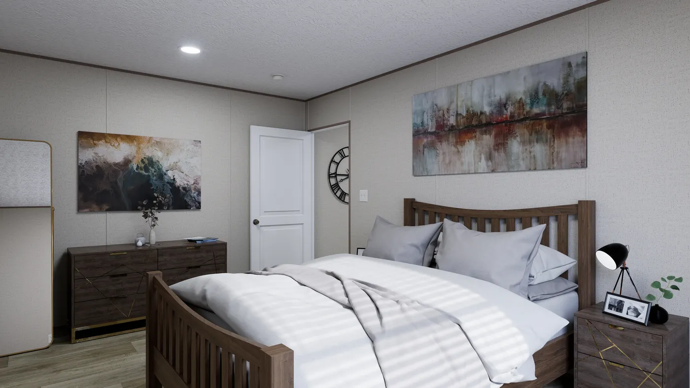 The FOOTHILLS 72 Primary Bedroom. This Manufactured Mobile Home features 3 bedrooms and 2 baths.