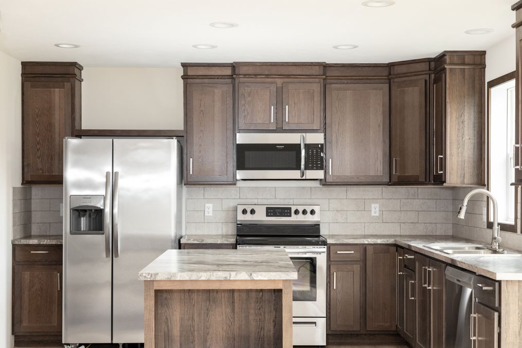 The TOMPKINS BLVD 6428-MS029 SECT Kitchen. This Manufactured Mobile Home features 3 bedrooms and 2 baths.