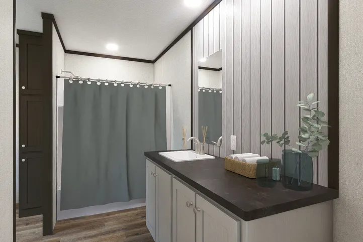 The REVEAL Primary Bathroom. This Manufactured Mobile Home features 3 bedrooms and 2 baths.