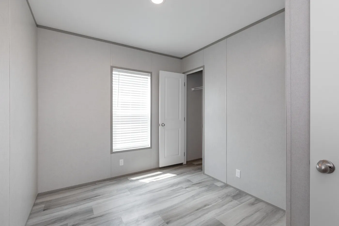 The THE ULTIMATE SHOWER Guest Bedroom. This Manufactured Mobile Home features 3 bedrooms and 2 baths.
