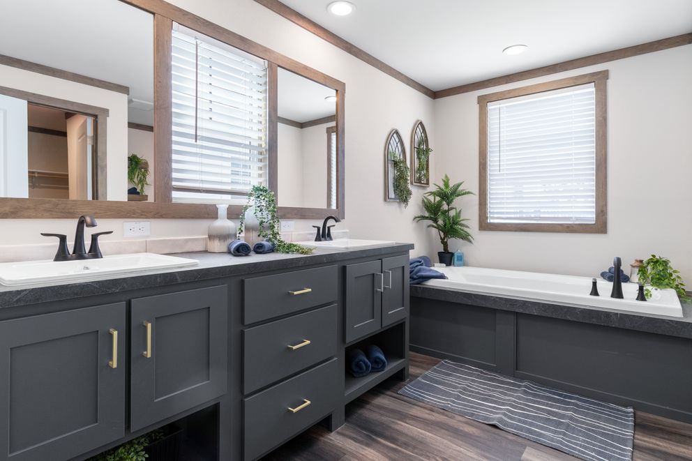 The FARM 4 FLEX Primary Bathroom. This Manufactured Mobile Home features 4 bedrooms and 3 baths.
