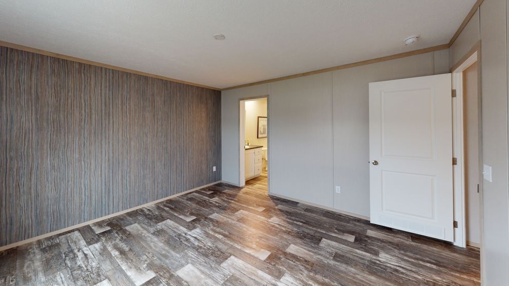 The FRANKLIN Primary Bedroom. This Manufactured Mobile Home features 3 bedrooms and 2 baths.
