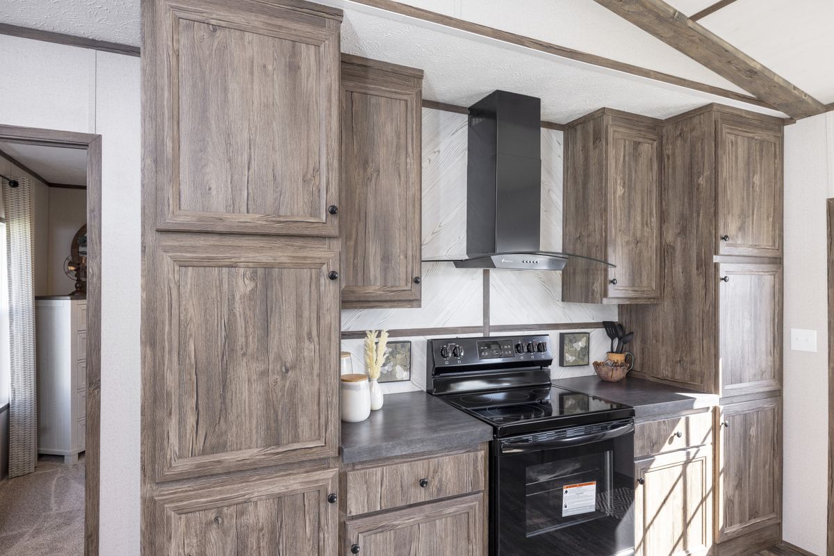 The THE SURE THING Kitchen. This Manufactured Mobile Home features 3 bedrooms and 2 baths.