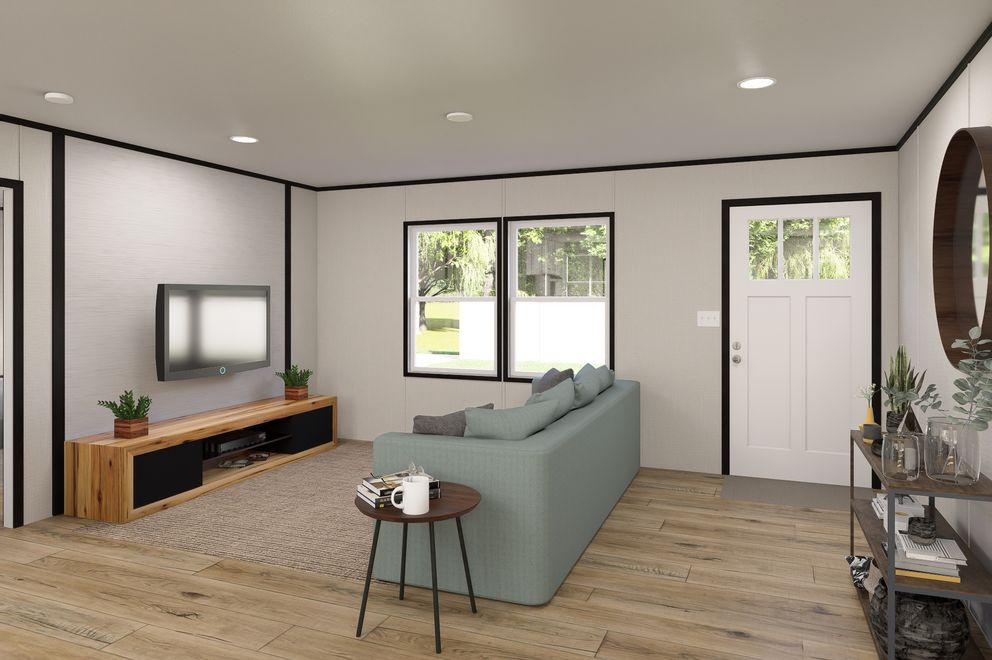 The ULTRA FLEX Living Room. This Manufactured Mobile Home features 3 bedrooms and 2 baths.
