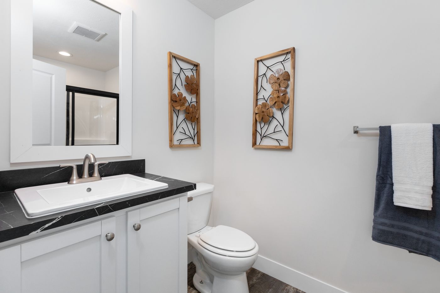 The 6016-SW019 SUNRISE SW Primary Bathroom. This Manufactured Mobile Home features 2 bedrooms and 2 baths.