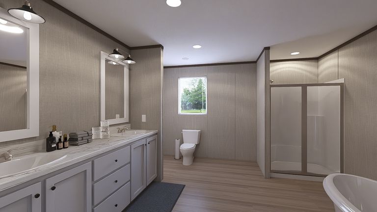 The THE RESERVE 60 Primary Bathroom. This Manufactured Mobile Home features 3 bedrooms and 2 baths.