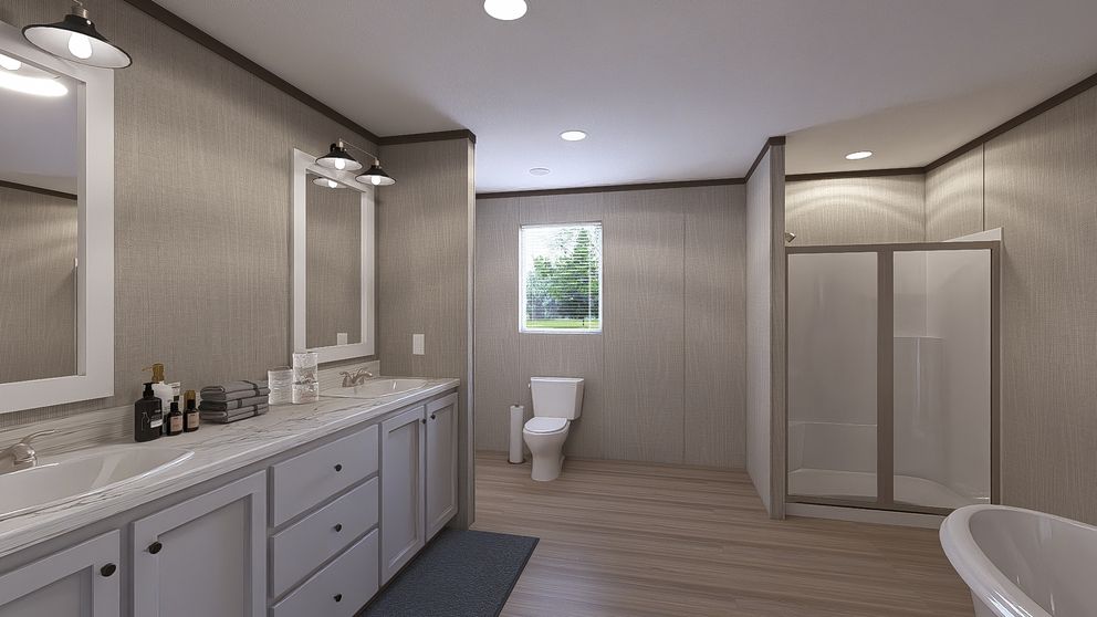 The THE RESERVE 60 Primary Bathroom. This Manufactured Mobile Home features 3 bedrooms and 2 baths.