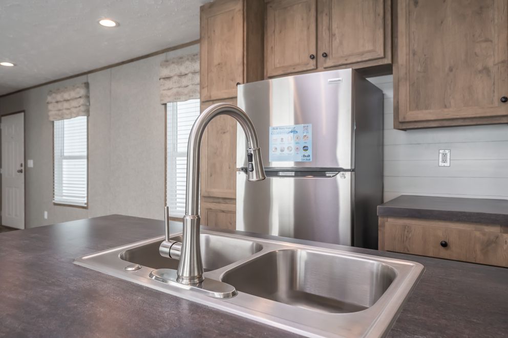 The LAKESIDE COTTAGE Kitchen. This Manufactured Mobile Home features 1 bedroom and 1 bath.