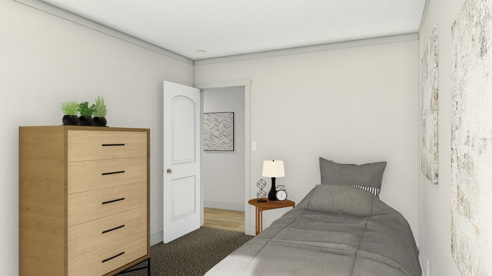 The FREE BIRD Guest Bedroom. This Manufactured Mobile Home features 3 bedrooms and 2 baths.