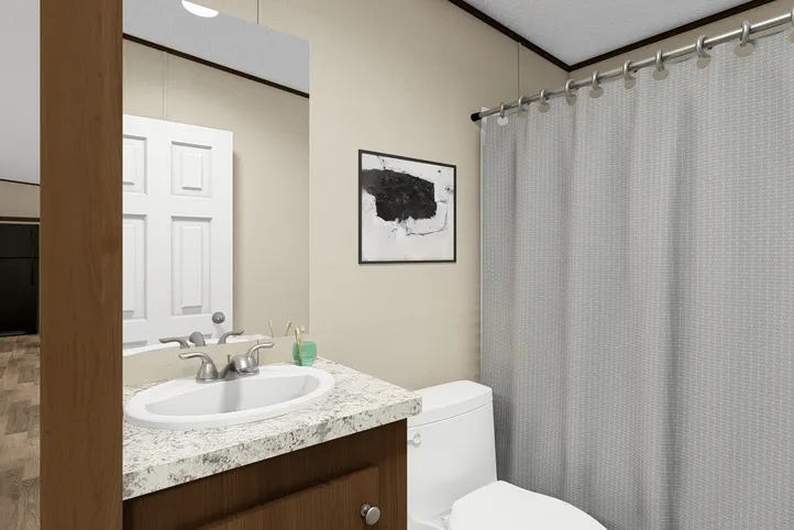 The TRIUMPH Guest Bathroom. This Manufactured Mobile Home features 5 bedrooms and 3 baths.
