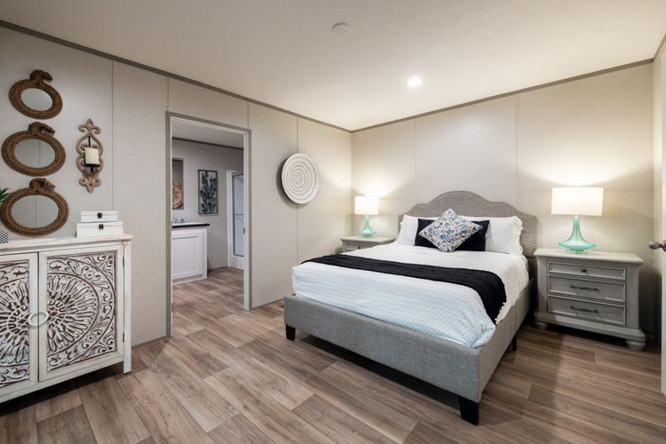 The NORTHSTAR Primary Bedroom. This Manufactured Mobile Home features 3 bedrooms and 2 baths.