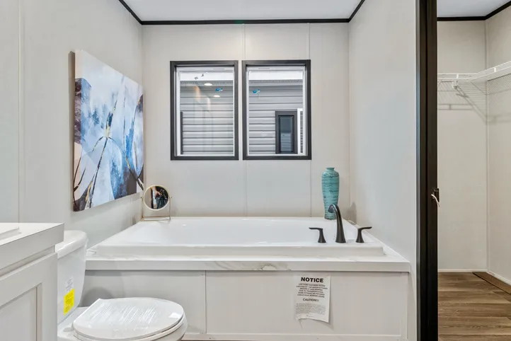 The THE RENEGADE Primary Bathroom. This Manufactured Mobile Home features 3 bedrooms and 2 baths.