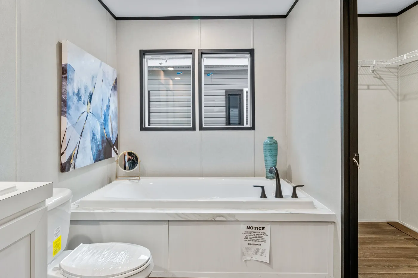 The THE RENEGADE Primary Bathroom. This Manufactured Mobile Home features 3 bedrooms and 2 baths.