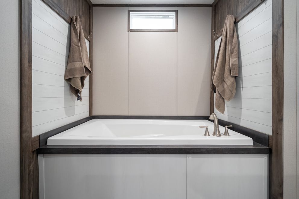 The THE GENERAL Primary Bathroom. This Manufactured Mobile Home features 3 bedrooms and 2 baths.