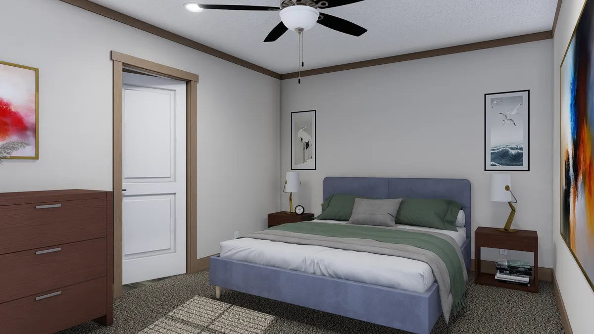 The TRINITY 60 Primary Bedroom. This Manufactured Mobile Home features 2 bedrooms and 2 baths.