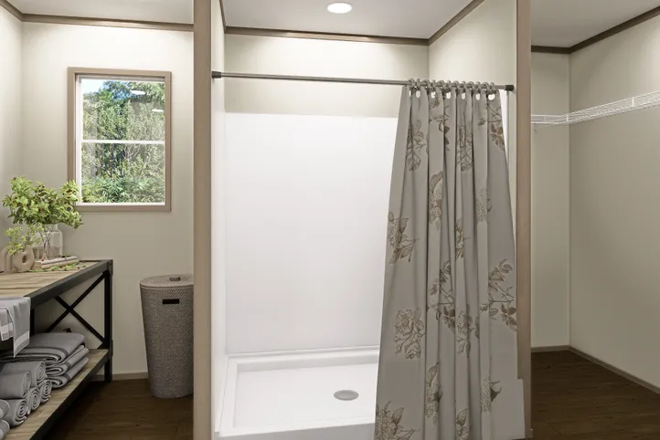 The RAINIER Primary Bathroom. This Manufactured Mobile Home features 4 bedrooms and 3 baths.