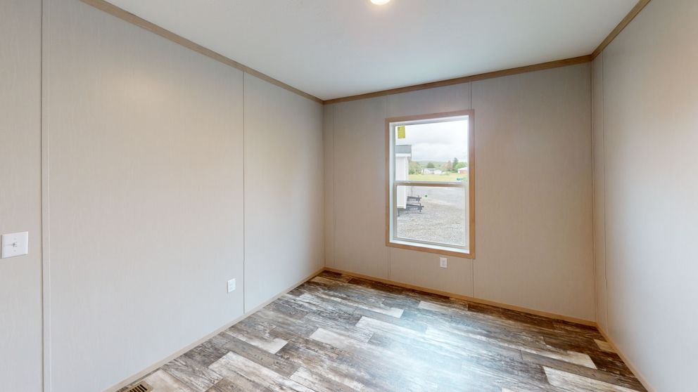 The HANCOCK Guest Bedroom. This Manufactured Mobile Home features 4 bedrooms and 2 baths.