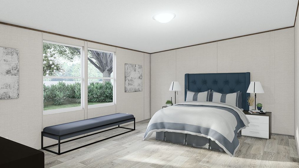 The THRILL Primary Bedroom. This Manufactured Mobile Home features 3 bedrooms and 2 baths.