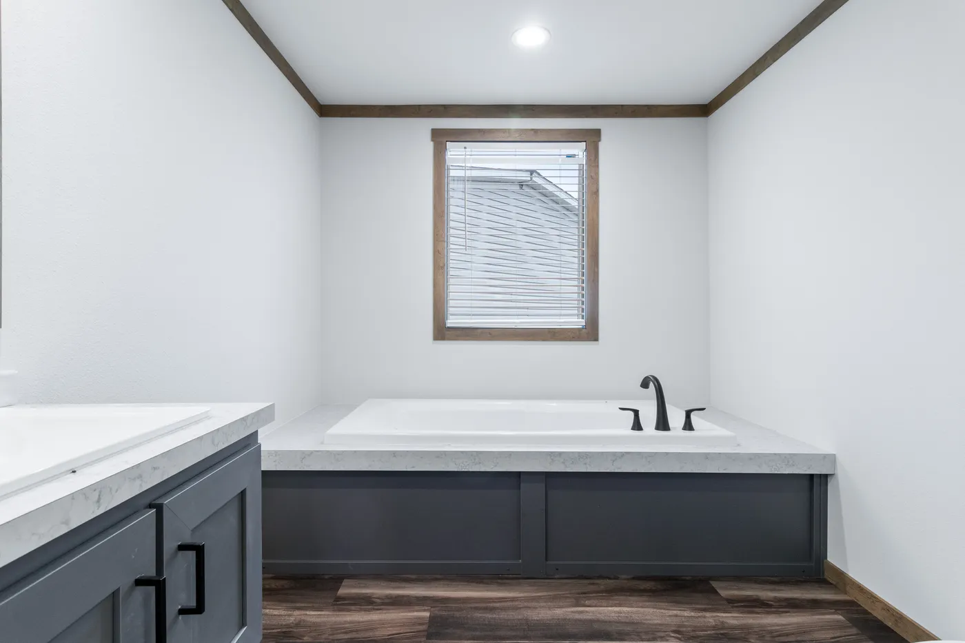 The EVERETT ELITE Primary Bathroom. This Manufactured Mobile Home features 4 bedrooms and 3 baths.