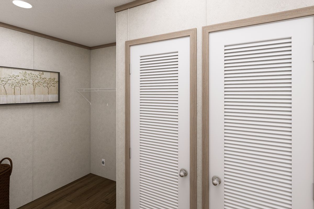 The 7616-CC01 CORNERSTONE 76 Utility Room. This Manufactured Mobile Home features 3 bedrooms and 2 baths.