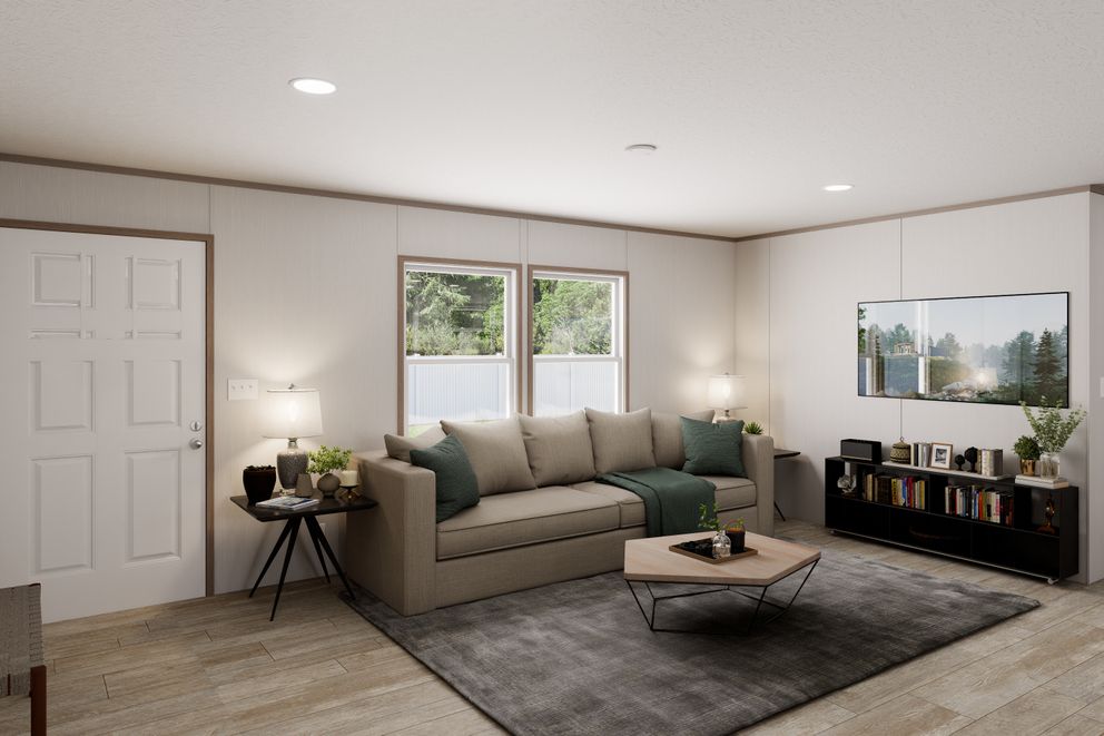 The ULTRA FLEX Living Room. This Manufactured Mobile Home features 3 bedrooms and 2 baths.
