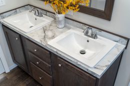 The MAVERICK 56A Primary Bathroom. This Manufactured Mobile Home features 3 bedrooms and 2 baths.