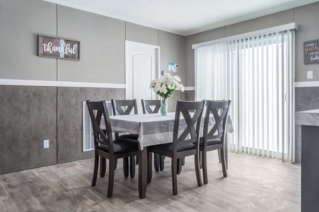The TRADITION 52B Dining Area. This Manufactured Mobile Home features 3 bedrooms and 2 baths.