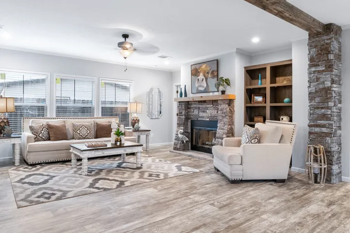 The THE BRYANT Living Room. This Manufactured Mobile Home features 4 bedrooms and 2 baths.