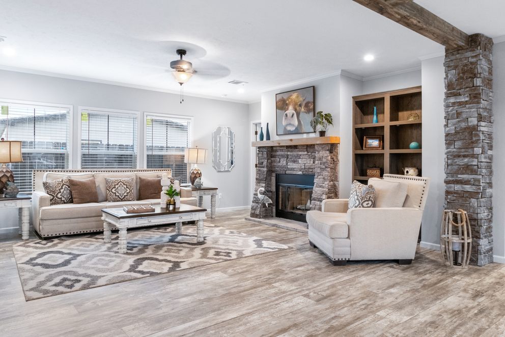 The THE BRYANT Living Room. This Manufactured Mobile Home features 4 bedrooms and 2 baths.