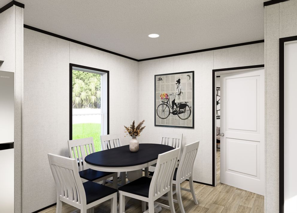 The NORTHSTAR Dining Area. This Manufactured Mobile Home features 3 bedrooms and 2 baths.