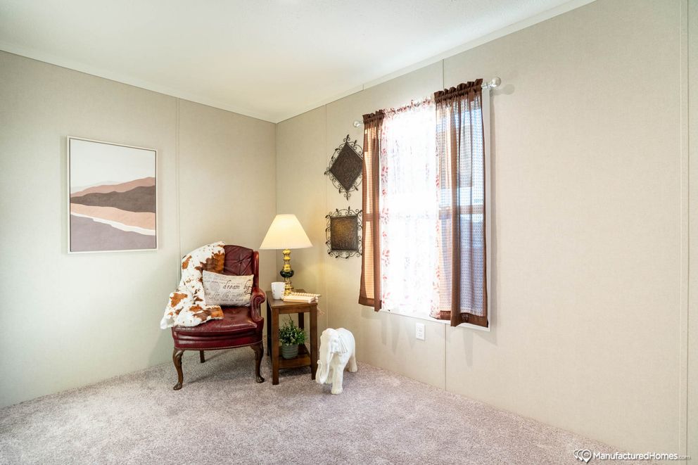 The TOPAZ 70 Guest Bedroom. This Manufactured Mobile Home features 3 bedrooms and 2 baths.