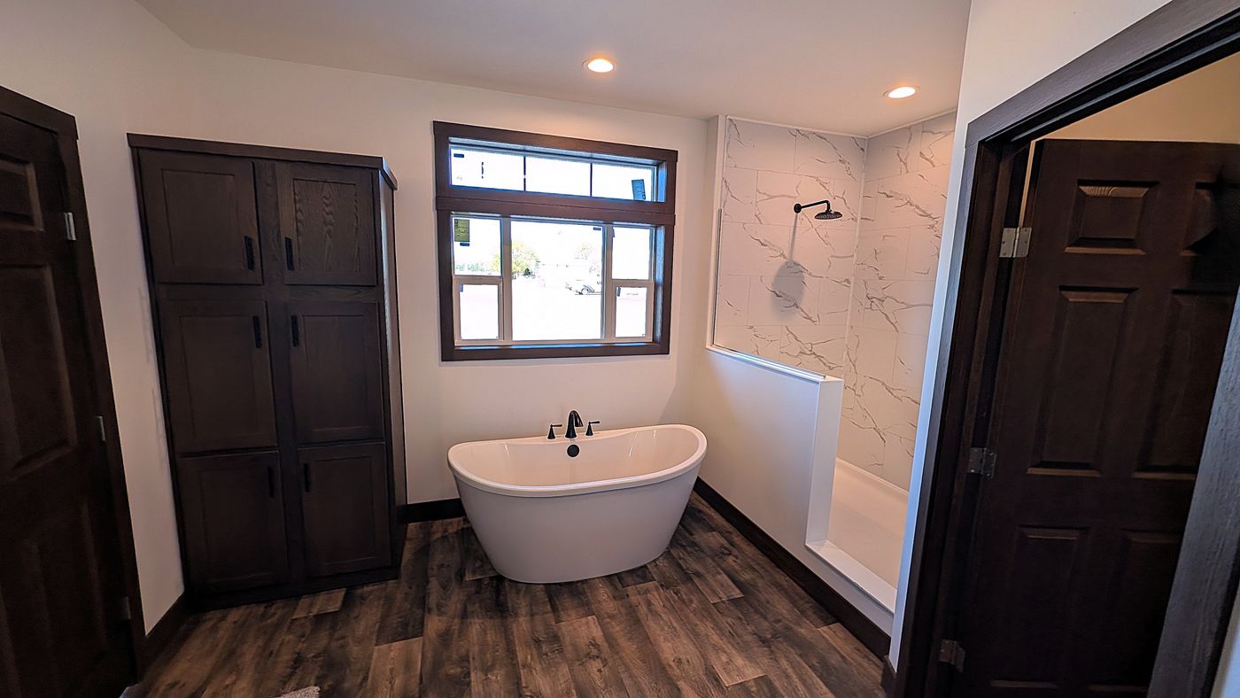 The LEGEND 402 MOD Primary Bathroom. This Modular Home features 3 bedrooms and 2 baths.